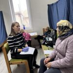 people working in a mobile clinic