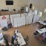people working in a mobile clinic