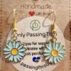 blue daisies1 Gold-tone hook earrings with light blue enamel daisies and yellow centers hanging from a display card that says Handmade with love and Only Passing Through